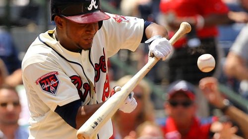 Braves pitcher Julio Teheran lays down a sacrifice bunt.       CURTIS COMPTON / CCOMPTON@AJC.COM