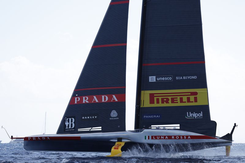 Luna Rosa Prada Pirelli sailing team competes during the Louis Vuitton Cup Final Day 7 at the Barcelona's coast, Spain, Friday, Oct. 4, 2024. (AP Photo/Joan Monfort)