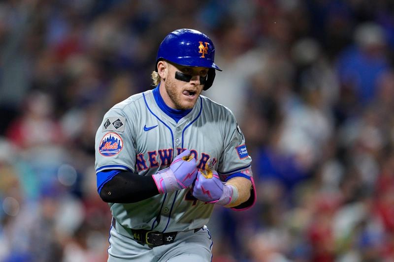 New York Mets' Harrison Bader reacts after hitting a three-run home run off Philadelphia Phillies' Tyler Gilbert during the eighth inning of a baseball game, Friday, Sept. 13, 2024, in Philadelphia. (AP Photo/Derik Hamilton)