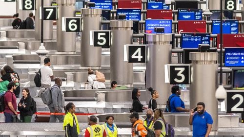 Travelers swelled Atlanta’s Hartsfield-Jackson International Airport on Friday, May 24, 2024. (John Spink/AJC)