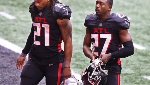 Atlanta Falcons running back Todd Gurley, 21, and Damontae Kazee, 27,  walk off the field after falling 30-26 to the Chicago Bears in an NFL football game on Sunday, Sept. 27, 2020 in Atlanta, GA. (Curtis Compton/Atlanta Journal-Constitution/TNS)