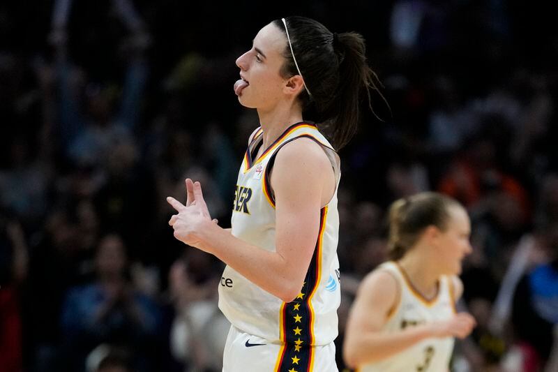 Indiana Fever guard Caitlin Clark celebrates after making a 3-pointer during the second half of a WNBA basketball game against the Los Angeles Sparks in Los Angeles, Friday, May 24, 2024. (AP Photo/Ashley Landis)