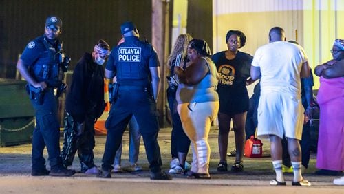 Family members and friends grieved at the scene where Atlanta police responded to a fatal stabbing on Ted Turner Drive on Thursday.