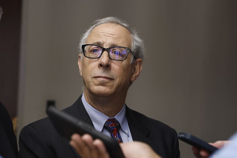 Petitioner Robert Wittenstein speaks to members of the media following a ballot challenge hearing on Monday, Aug. 19, 2024, in Atlanta. In Georgia, challengers argue that because Robert F. Kennedy Jr. used the New York address on petitions needed for an independent to qualify, his petitions should be voided. (Natrice Miller/Atlanta Journal-Constitution via AP)