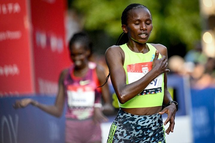 Stacy Ndiwa crosses the finish line with a time of 31:12 during the 55th running of the Atlanta Journal-Constitution Peachtree Road Race on Thursday, July 4, 2024.  ( Hyosub.Shin / ajc.com)