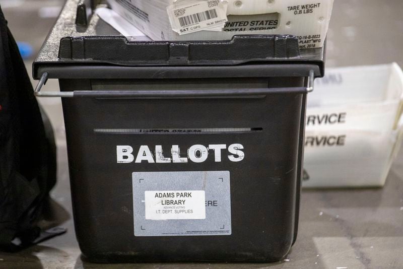 A black ballot box used for holding mail-in ballots. (ALYSSA POINTER / ALYSSA.POINTER@AJC.COM)
