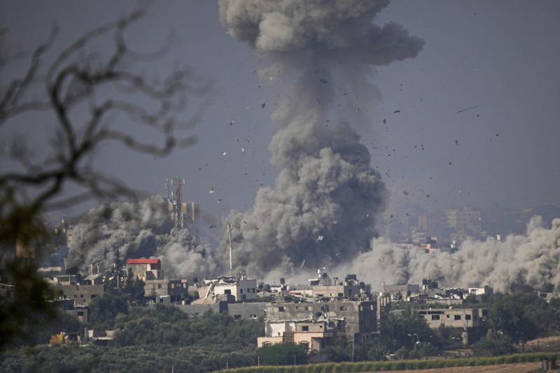 Smoke rises following an Israeli airstrike in the Gaza Strip, as seen from southern Israel, Monday, Oct. 23, 2023. (AP Photo/Ariel Schalit)