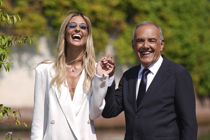 Director of the festival Alberto Barbera, right and Patroness of the festival Sveva Alviti arrive at the Excelsior pier ahead of the 81st Venice International Film Festival, Tuesday, Aug. 27, 2024 in Venice, Italy. (Gian Mattia D'Alberto/LaPresse via AP)