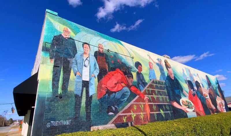 This is a large mural painted on the side of The Food Mill in Columbus, Georgia. Brittney Espersen, the general manager/chef at The Food Mill in Columbus, Georgia, is among those depicted in the mural. (Photo Courtesy of Mike Haskey)