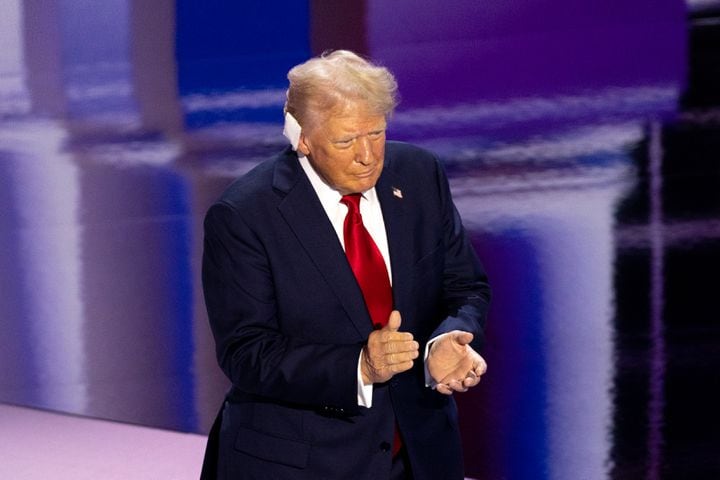 Former president Donald Trump walks onto the stage to accept the Republican presidential nomination at Fiserv Form in Milwaukee on Thursday, July 18, 2024, the fourth day of the Republican National Convention (Arvin Temkar / AJC)