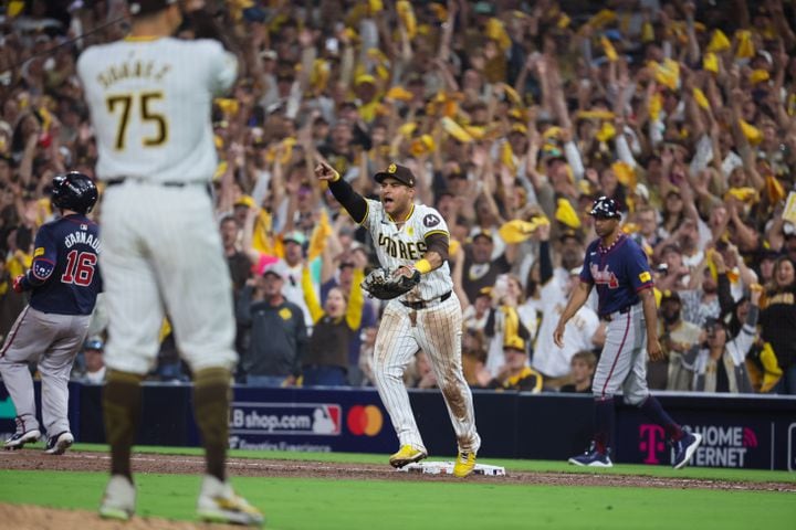 Atlanta Braves catcher Travis d'Arnaud (16) is forced out  by San Diego Padres first baseman Donovan Solano, left, to end the ninth inning of National League Division Series Wild Card Game One at Petco Park in San Diego on Tuesday, Oct. 1, 2024. San Diego won 4-0.   (Jason Getz / Jason.Getz@ajc.com)