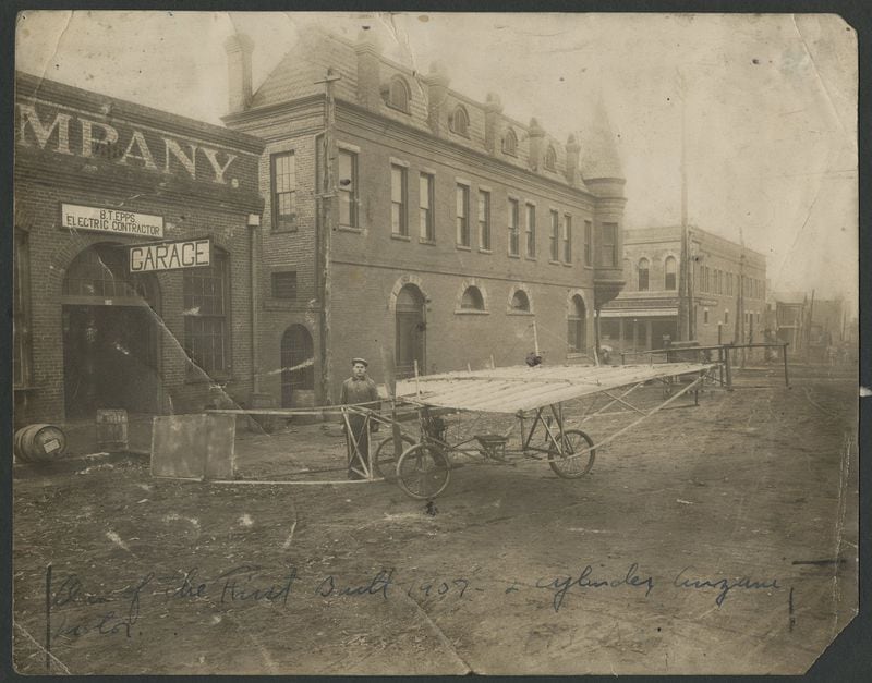 Ben Epps stands in front of his Athens shop with the second of the airplanes that he and Zumpt Huff constructed. This one never flew. The handwritten inscription led to much misunderstanding about the the date of the photograph. CONTRIBUTED BY HARGRETT LIBRARY; WITH PERMISSION OF BEN T. EPPS FAMILY