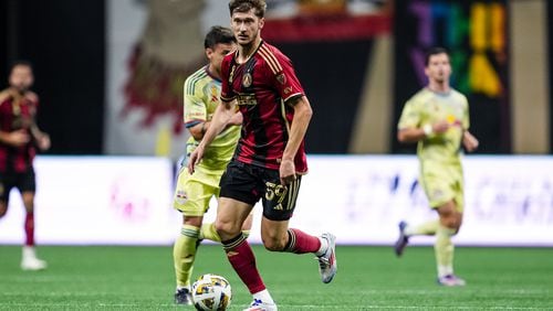 Atlanta United midfielder Alexey Miranchuk #59 dribbles the ball during the match against the New York Red Bulls at Mercedes-Benz Stadium in Atlanta, GA on Saturday October 5, 2024. (Photo by Mitch Martin/Atlanta United)