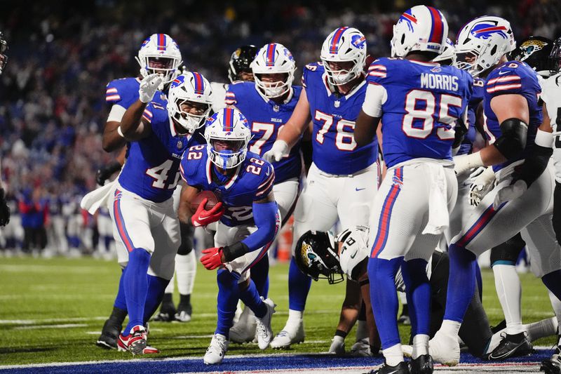 Buffalo Bills running back Ray Davis (22) scores a rushing touchdown against the Jacksonville Jaguars during the second half of an NFL football game Monday, Sept. 23, 2024, in Orchard Park, NY. (AP Photo/Steven Senne)