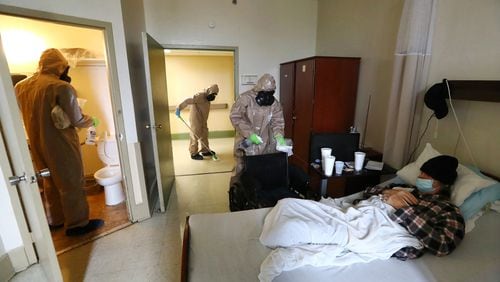 Georgia National Guardsmen disinfect a resident's room at a nursing home in Atlanta amid the coronavirus pandemic in April 2020.
