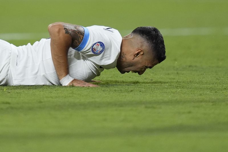 Uruguay's Luis Suarez reacts after missing a chance to score against Colombia during a Copa America semifinal soccer match in Charlotte, N.C., Wednesday, July 10, 2024. (AP Photo/Julia Nikhinson)