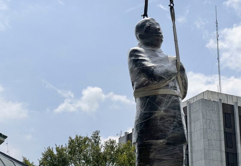 A large bronze statue of the late civil rights leader and politician Congressman John Lewis is installed where a monument to the Confederacy once stood on Friday, Aug. 16, 2024, in Decatur, Ga. (AP Photo/Ron Harris)