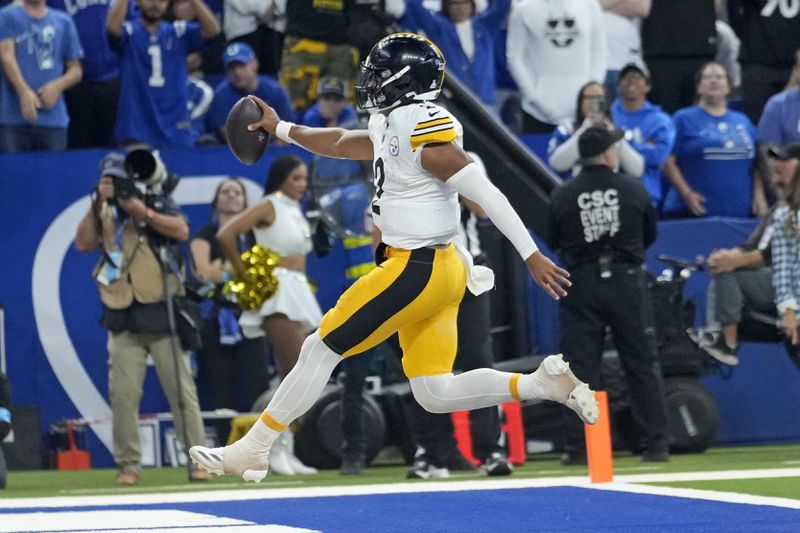 Pittsburgh Steelers quarterback Justin Fields (2) leaps into the end zone for a touchdown during the second half of an NFL football game against the Indianapolis Colts, Sunday, Sept. 29, 2024, in Indianapolis. (AP Photo/Michael Conroy)