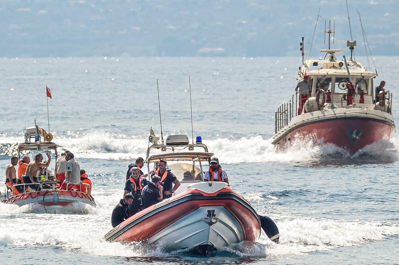 Italian firefighter divers work at the site of a shipwreck, in Porticello, Sicily, southern Italy, Thursday, Aug. 22, 2024. Divers searching the wreck of the superyacht Bayesian that sank off Sicily on Monday recovered a fifth body on Thursday and continued to search for one more as investigators sought to learn why the vessel sank so quickly. (AP Photo/Salvatore Cavalli)