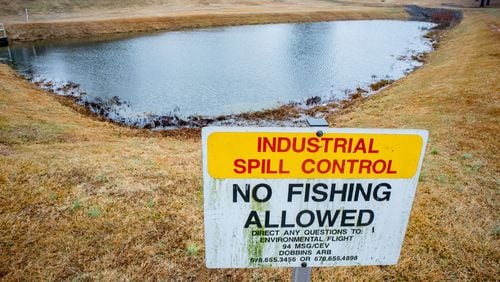 FILE: Standing water collects in a spill pond on Dobbins Air Reserve Base in Marietta. The spill pond was among those impacted by contamination from a special firefighting foam used by the military. STEVE SCHAEFER / SPECIAL TO THE AJC