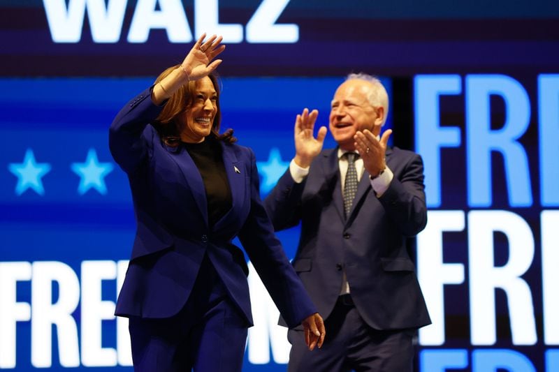 Vice President Kamala Harris and her running mate, Minnesota Gov. Tim Walz, greet supporters at a rally in Milwaukee on Tuesday.