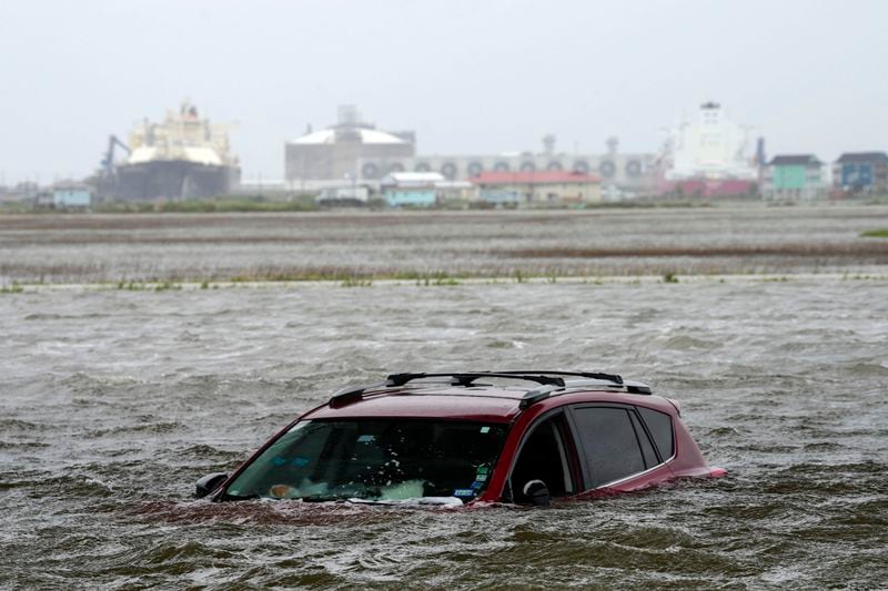 A car sits submerged in water as Tropical Storm Alberto approaches land Wednesday, June 19, 2024, in Surfside Beach, Texas. (Jon Shapley/Houston Chronicle via AP)