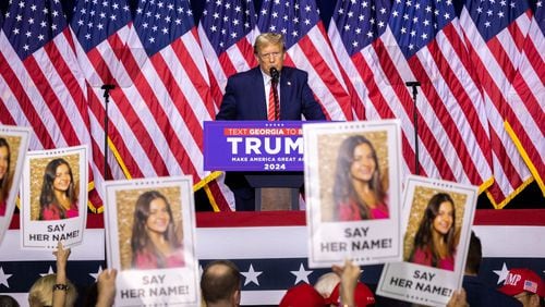 Former President Donald Trump speaks about slain nursing student Laken Riley during a March rally in Rome as supporters hold up signs with her photo. (Arvin Temkar/The Atlanta Journal-Constitution/TNS)