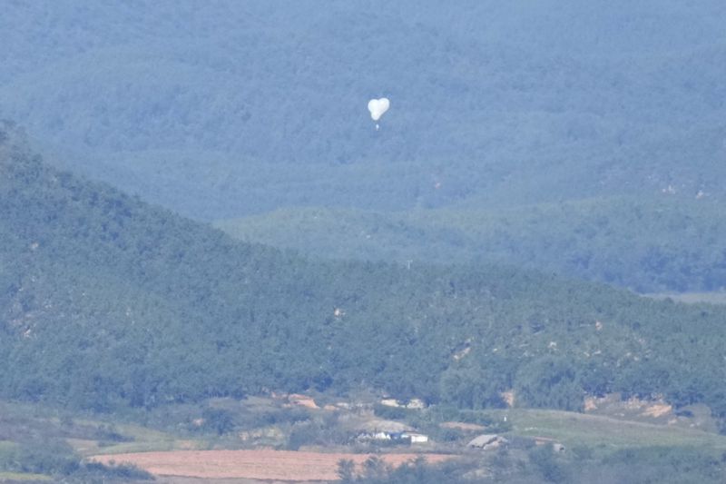 North Korean balloons are seen from the Unification Observation Post in Paju, South Korea, near the border with North Korea, Friday, Oct. 4, 2024. (AP Photo/Lee Jin-man)