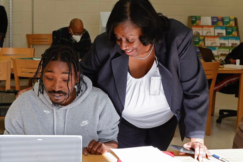Atlanta Public Schools interim Superintendent Danielle Battle chats with student Tony Benson during his class at the district's Adult Education Center on Friday, Jan. 19, 2024. (Natrice Miller/ Natrice.miller@ajc.com)