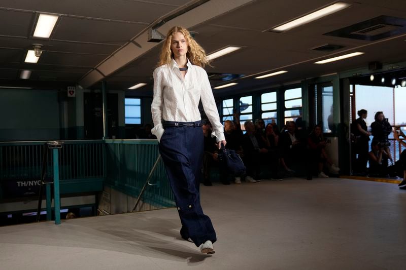 A model walks the runway during the Tommy Hilfiger Spring/Summer 2025 fashion show onboard a Staten Island Ferry as part of New York Fashion Week on Sunday, Sept. 8, 2024, in New York. (Photo by Charles Sykes/Invision/AP)