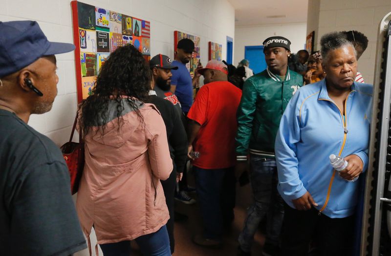Voters wait in line at Pittman Park Recreation Centers on Tuesday, Nov. 6, 2018.