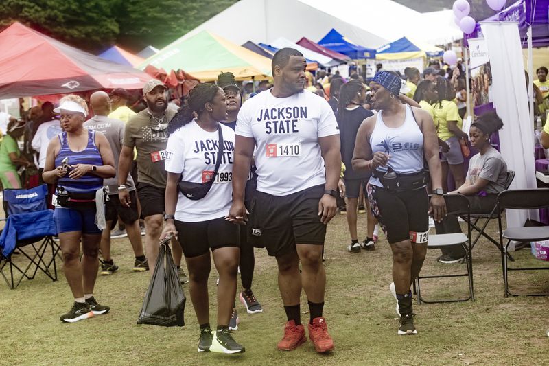 Runners look over the vendor booths before the start of the 17th Annual Atlanta HBCU Alumni Alliance 5K Run/Walk at Piedmont Park on Saturday morning, June 29, 2024.  (Steve Schaefer / AJC)