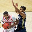 Ohio State's E.J. Liddell, left, gets pressure from Oral Roberts' Kevin Obanor during the first half of a First Round game in the NCAA men's college basketball tournament, Friday, March 19, 2021, at Mackey Arena in West Lafayette, Ind. (AP Photo/Robert Franklin)