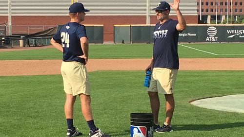 Georgia Tech pitching coach Danny Borrell works with freshman pitcher Brody Wesbrooks after a fall practice on September 17, 2019 at Russ Chandler Stadium. (AJC photo by Ken Sugiura)