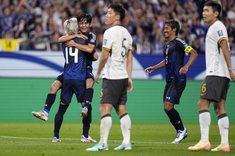 Japan's Junya Ito, 14, celebrates his goal during a World Cup and AFC Asian Qualifier between Japan and China at Saitama Stadium 2002 in Saitama, north of Tokyo, Thursday, Sept. 5, 2024.(AP Photo/Shuji Kajiyama)