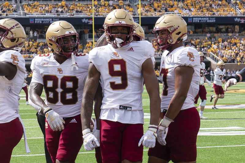 Boston College wide receiver Jerand Bradley (9) celebrates his touchdown with teammates Sedarius McConnell (88) and Jeremiah Franklin, right, during the first half of an NCAA college football game against Missouri, Saturday, Sept. 14, 2024, in Columbia, Mo. (AP Photo/L.G. Patterson)