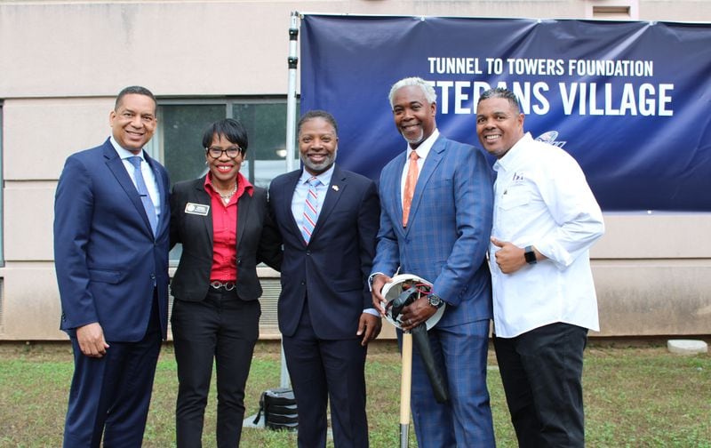 (Left to right) Cobb County District Attorney Flynn Broady, Commissioner Monique Sheffield, Mableton Mayor Michael Owens, founder and senior pastor of Word of Faith Family Worship Cathedral Dale Bronner, and General Manager of the Riverside Epicenter Christopher Boyd pose for a photo at the groundbreaking of the future Atlanta Veterans Village in Austell, Georgia, on Friday, May 17, 2024. (Taylor Croft/taylor.croft@ajc.com)