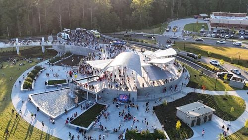 Suwanee’s Town Center on Main and DeLay Nature Park features an elevated bridge, a large lawn for events and recreation, a veterans monument, two ponds and a beach volleyball court. (Photo Courtesy of Lee Heard)