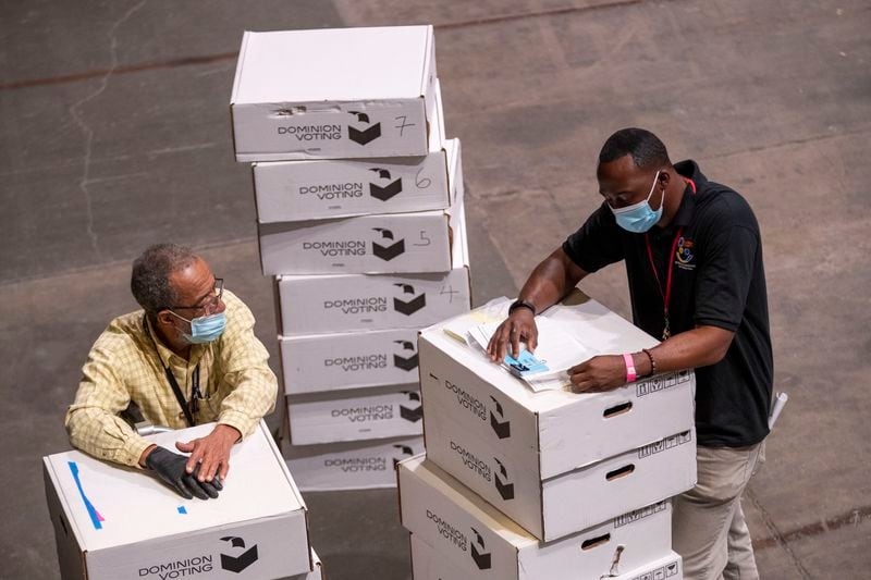 Technical set-up began Wednesday at State Farm Arena as employees of the Fulton County department of registrations and elections worked on securing the electronic voter machines that will be used for early voting at State Farm Arena in Atlanta, Wednesday, October 7, 2020. (Alyssa Pointer / Alyssa.Pointer@ajc.com)