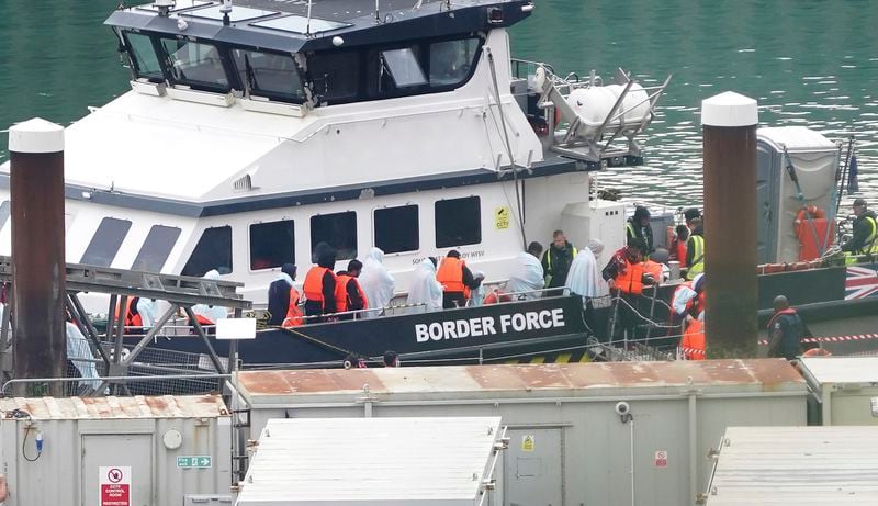 A group of people thought to be migrants are brought in to Dover, Kent, from a Border Force vessel following a small boat incident in the Channel, Wednesday Sept. 4, 2024. (Gareth Fuller/PA via AP)