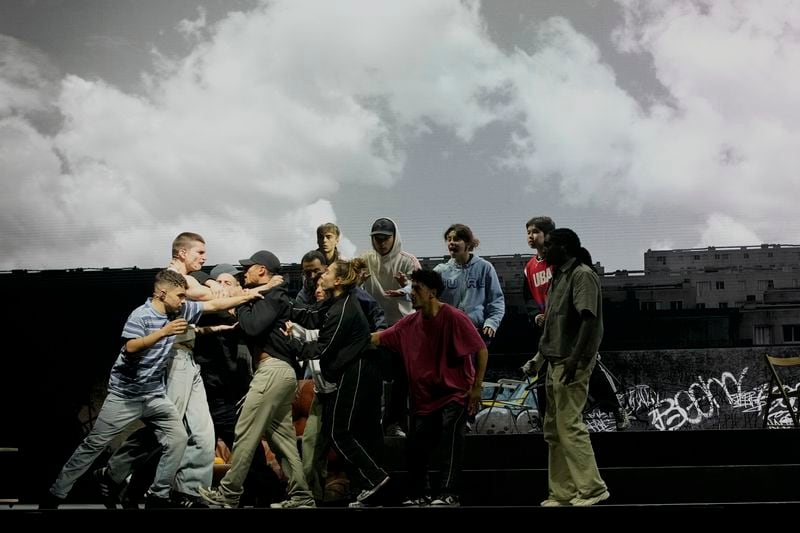 Actors perform during a rehearsal of La Haine musical show, in Tremblay en France, Tuesday, Sept. 17, 2024. (AP Photo/Christophe Ena)