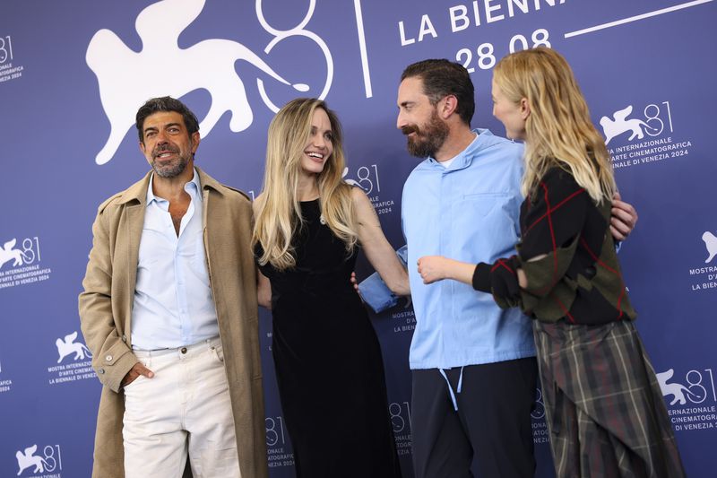 Pierfrancesco Favino, from left, Angelina Jolie, director Pablo Larrain and Alba Rohrwacher pose for photographers at the photo call for the film 'Maria' during the 81st edition of the Venice Film Festival in Venice, Italy, on Thursday, Aug. 29, 2024. (Photo by Vianney Le Caer/Invision/AP)