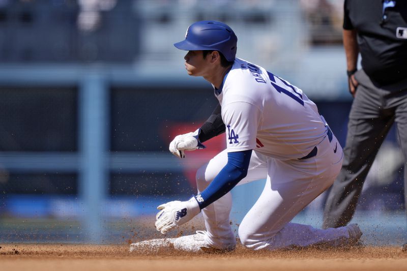 Los Angeles Dodgers' Shohei Ohtani steals second during the third inning of a baseball game against the Colorado Rockies, Sunday, Sept. 22, 2024, in Los Angeles. (AP Photo/Mark J. Terrill)