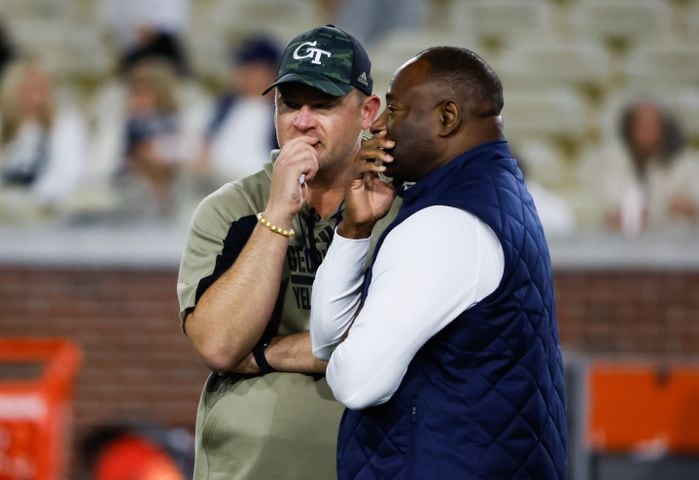 Georgia Tech Yellow Jackets head coach Brent Key (left) has a word with Syracuse Orange head coach Dino Babers before an NCAA college football game between Georgia Tech and Syracuse in Atlanta on Saturday, Nov. 18, 2023.   (Bob Andres for the Atlanta Journal Constitution)