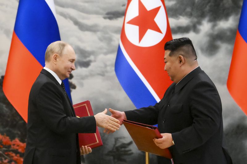 FILE - Russian President Vladimir Putin, left, and North Korea's leader Kim Jong Un exchange documents during a signing ceremony of the new partnership in Pyongyang, North Korea, on June 19, 2024. Kim and Putin signed a major defense deal that observers worry could embolden Kim to direct more provocations at South Korea. (Kristina Kormilitsyna, Sputnik, Kremlin Pool Photo via AP, File)