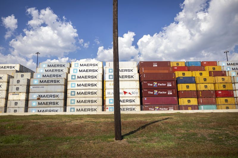 Stacked containers line the Bayport Container Terminal during the first day of a dockworkers strike on Tuesday, Oct. 1, 2024, in Houston. (AP Photo/Annie Mulligan)