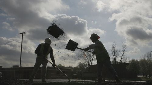 A C.W. Matthews Construction Co. paving crew works in Smyrna in March 2007.