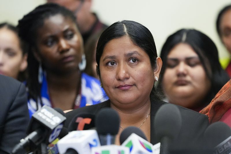 Maria del Carmen Castellón, the wife of Miguel Luna, a welder who died during the collapse of Baltimore's Francis Scott Key Bridge, speaks during a press conference, Tuesday, Sept. 17, 2024, in Baltimore. (AP Photo/Stephanie Scarbrough)