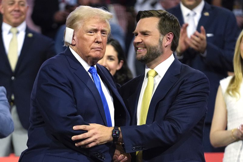 FILE - Republican presidential candidate former President Donald Trump, left, is introduced alongside Republican vice presidential candidate Sen. JD Vance, R-Ohio, during the Republican National Convention, July 16, 2024, in Milwaukee. (AP Photo/Paul Sancya, File)