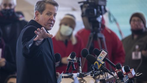 Gov. Brian Kemp makes remarks after touring a Cobb and Douglass County Public Health Department COVID-19 vaccine drive thru site at Jim Miller Park in Marietta Wednesday. (Alyssa Pointer / Alyssa.Pointer@ajc.com)